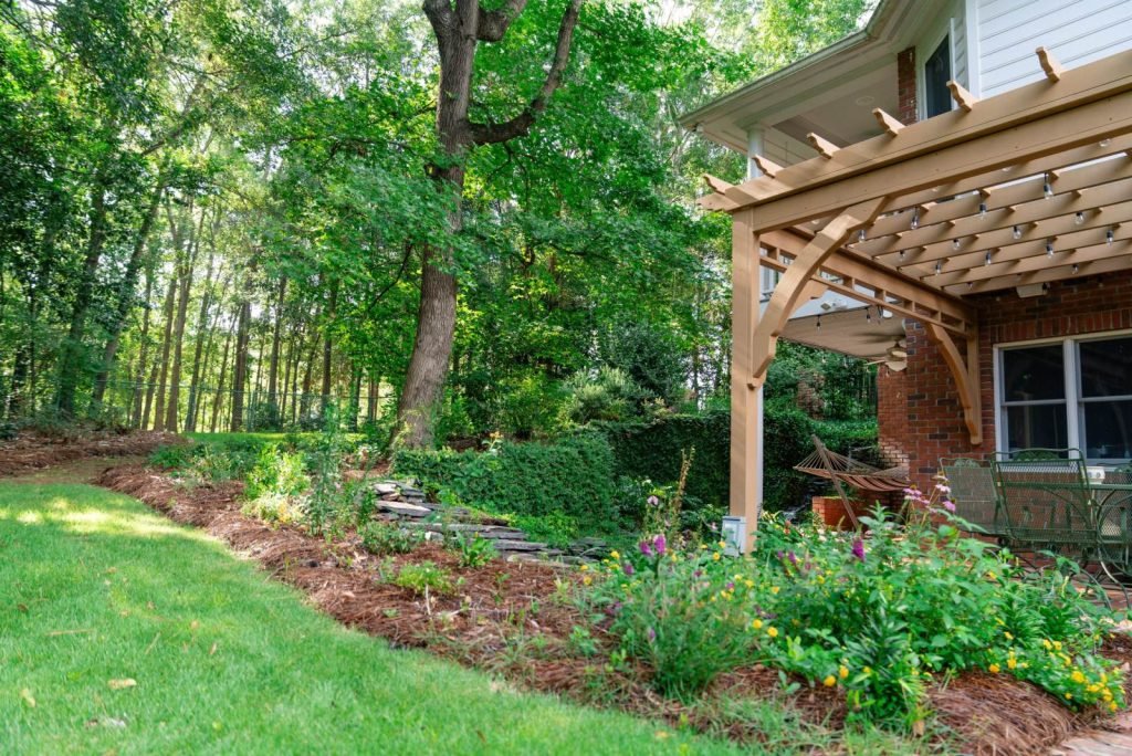 Backyard landscaping and pergola project by Premium Petals in the Wiregrass, AL